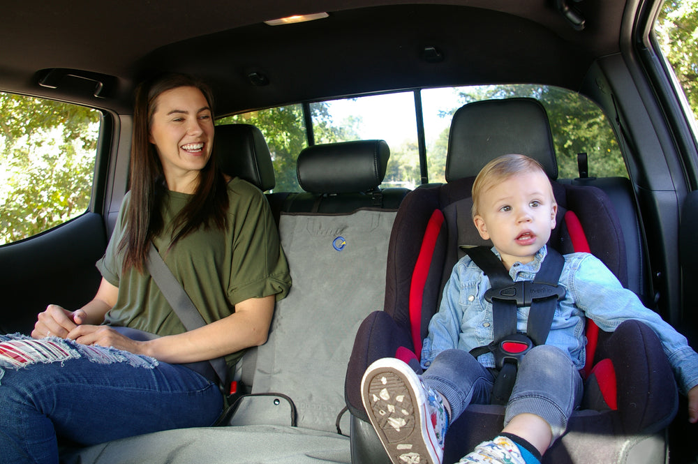 Bench rear seat cover in truck with mom and son (kid)