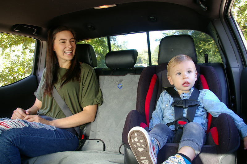 Bench rear seat cover in truck with mom and son (kid)