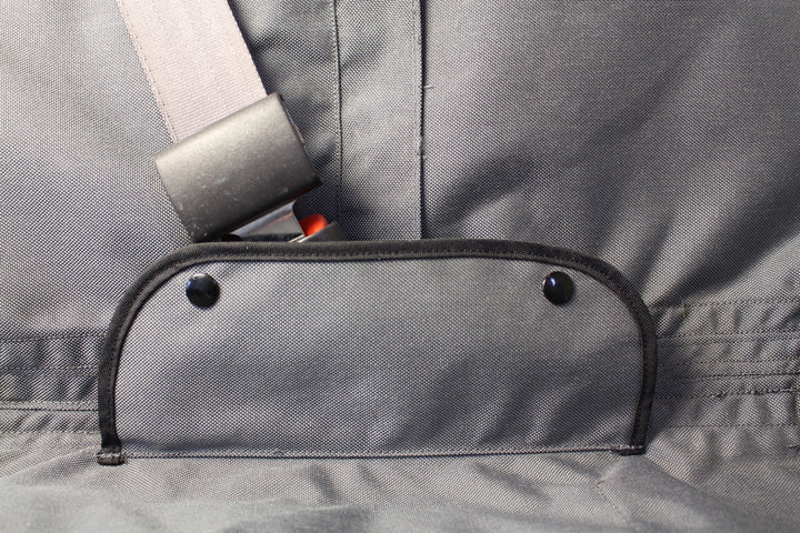 Vehicle seat cover with covers over seat belt buckle hardware while in use