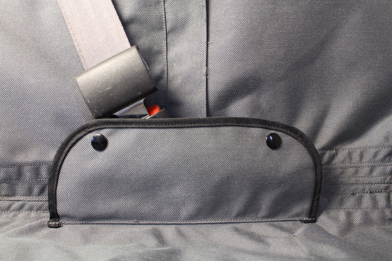 Vehicle seat cover with covers over seat belt buckle hardware while in use